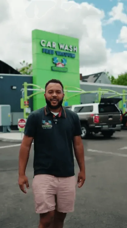 A Bubble Bay team member walking through the wash lot